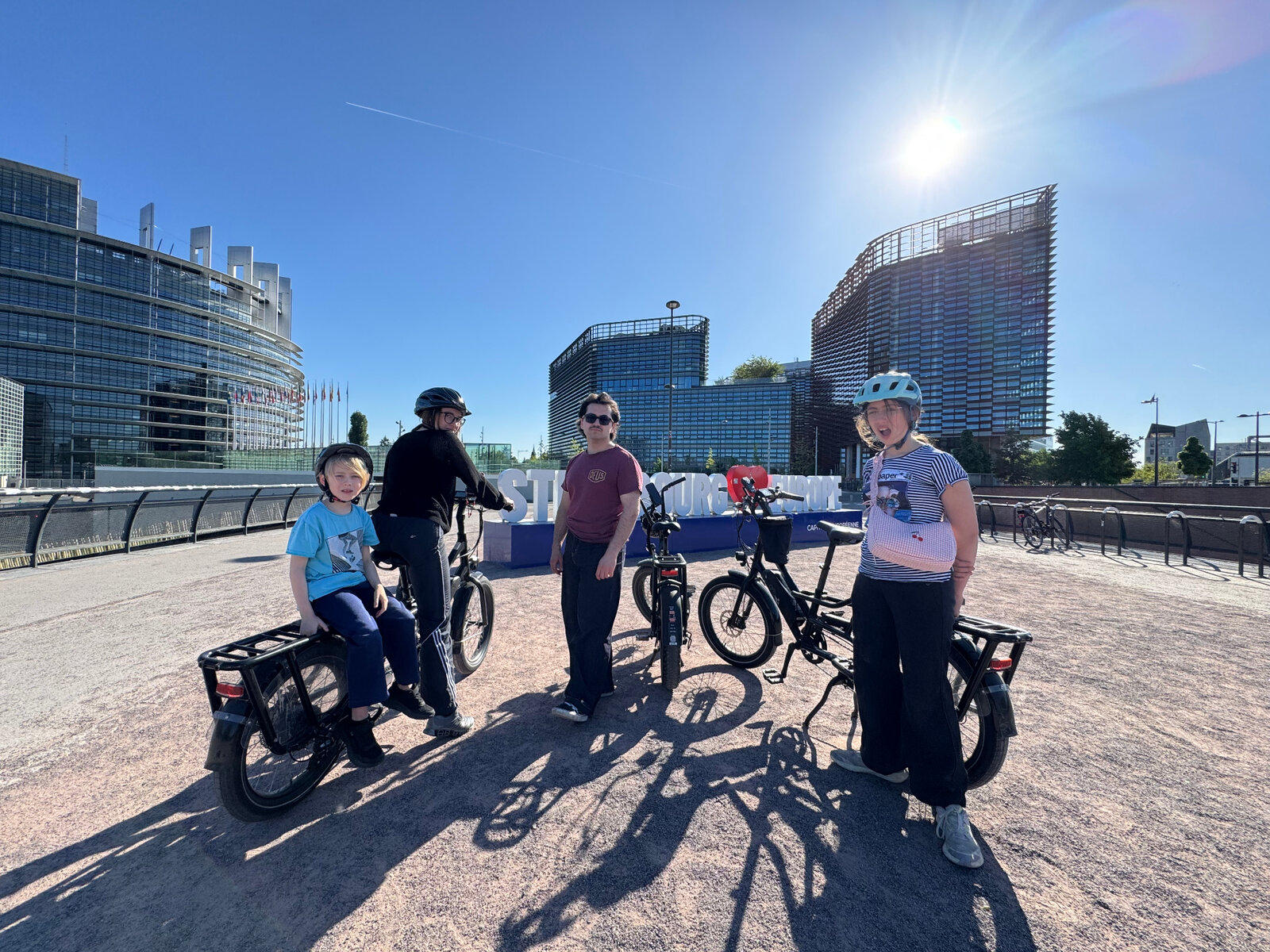 Riders with e-bikes in front of the European Parliament in Strasbourg